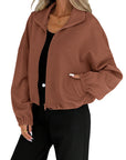 Chaqueta de mujer con cuello alto y cremallera – Corte holgado y cordón en el bajo. Estilo informal para otoño-invierno