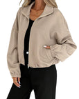 Chaqueta de mujer con cuello alto y cremallera – Corte holgado y cordón en el bajo. Estilo informal para otoño-invierno